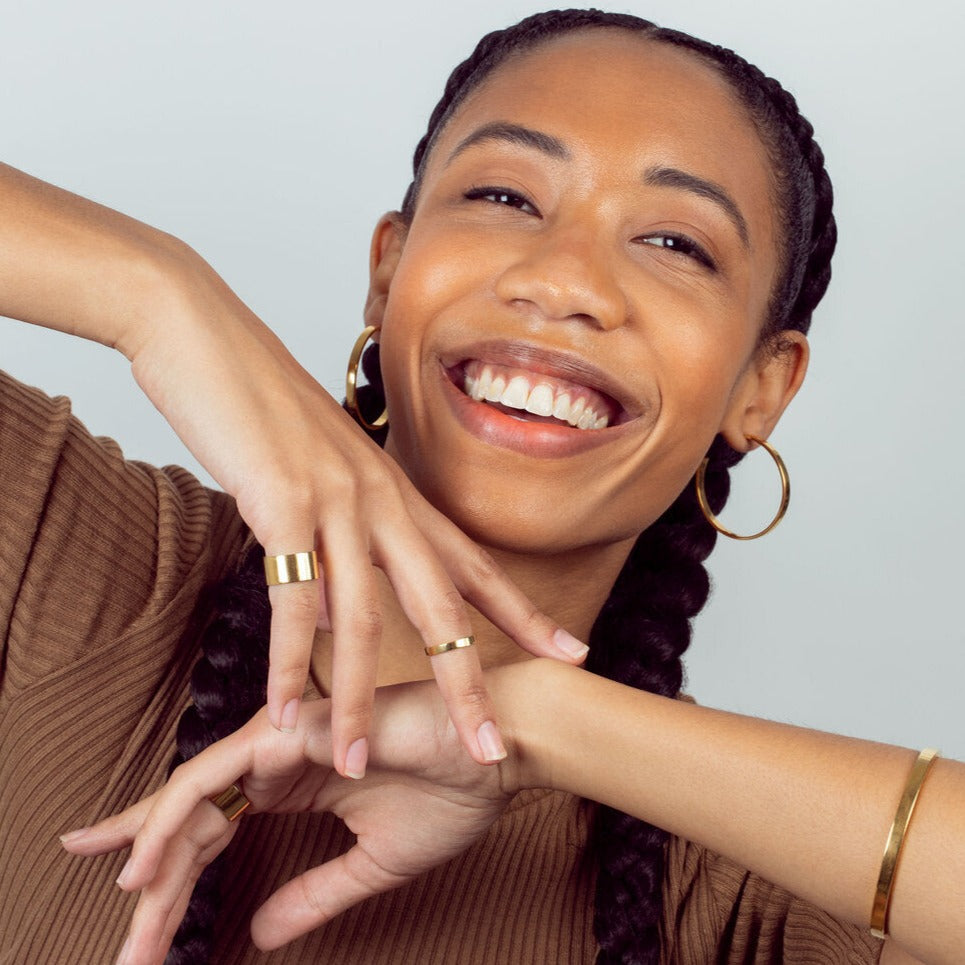 This Cyclical Thick Ring provides a solid circular design which is both simple and sophisticated. Our thick ring in yellow gold is a classic band style. It is the perfect piece for stacking. Layer with the cyclical thin ring to complete the look.