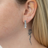 Flex hoops with Lab Grown Diamonds are a modern fashion statement perfect for everyday wear. This stunning pair of earrings features sparkling lab grown diamonds set in sterling silver, allowing for a lightweight, comfortable fit. With its unique shape and sophisticated design, this pair of earrings is sure to elevate any ensemble. They are the perfect size for everyday wear. Wear with the Flex Necklace to complete the look.