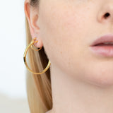Crafted with beautiful lab-grown diamonds, these earrings add a touch of sophistication to any outfit. Get the luxurious sparkle of diamonds without the ethical and environmental concerns that come with mined diamonds. It is the perfect pair for curating the ear. Wear with the small hoops and huggie hoops to complete the look.