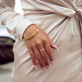 Our Cyclical Thin Ring is the perfect accessory. Featuring an elegant circular design, this thin ring boasts a sophisticated style that complements any outfit.