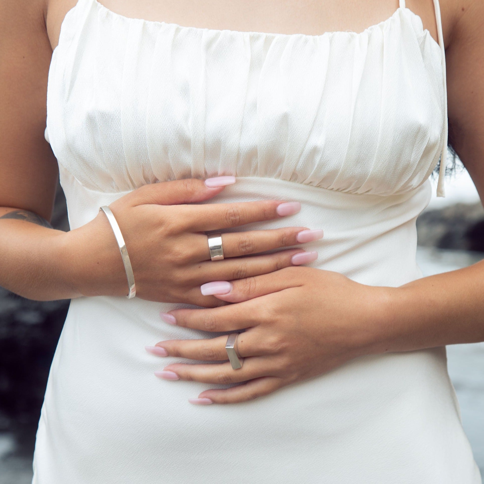 This sophisticated sterling silver bangle from our Cyclical collection is the perfect way to add a timeless flair to any look. Its classic design features a timeless silhouette that pairs effortlessly with a variety of styles. Wear with the cyclical thick or thin ring to complete the look.