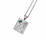 A silver-toned pendant necklace featuring the Cancer zodiac sign with a small green rectangular gemstone, shown on a clean white background.