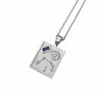 A silver-toned rectangular pendant necklace featuring an engraved zodiac symbol, stars, a sun motif, and a small purple gemstone, suspended from a matching silver chain against a white background.