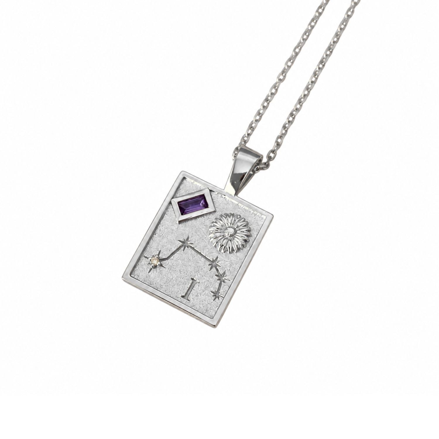 A silver-toned rectangular pendant necklace featuring an engraved zodiac symbol, stars, a sun motif, and a small purple gemstone, suspended from a matching silver chain against a white background.