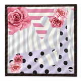 A square silk scarf featuring a modern abstract pattern with pink watercolor roses, pink and white stripes, lavender polka dots, and gray wavy lines, finished with a dark brown border.