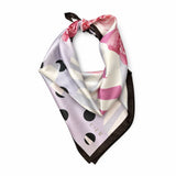 A square silk scarf with a modern abstract print featuring pink watercolor brushstrokes, black polka dots, and diagonal stripes on a light lavender background, finished with a dark brown border and tie. The brand name 'CIER' is printed near the bottom corner.