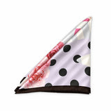 A folded square scarf with a light lavender background, black polka dots, pink rose floral print, and a dark brown border, displayed on a clean white background.