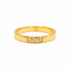 A gold vermeil ring featuring three lab grown diamonds bezel set, on a white background. 