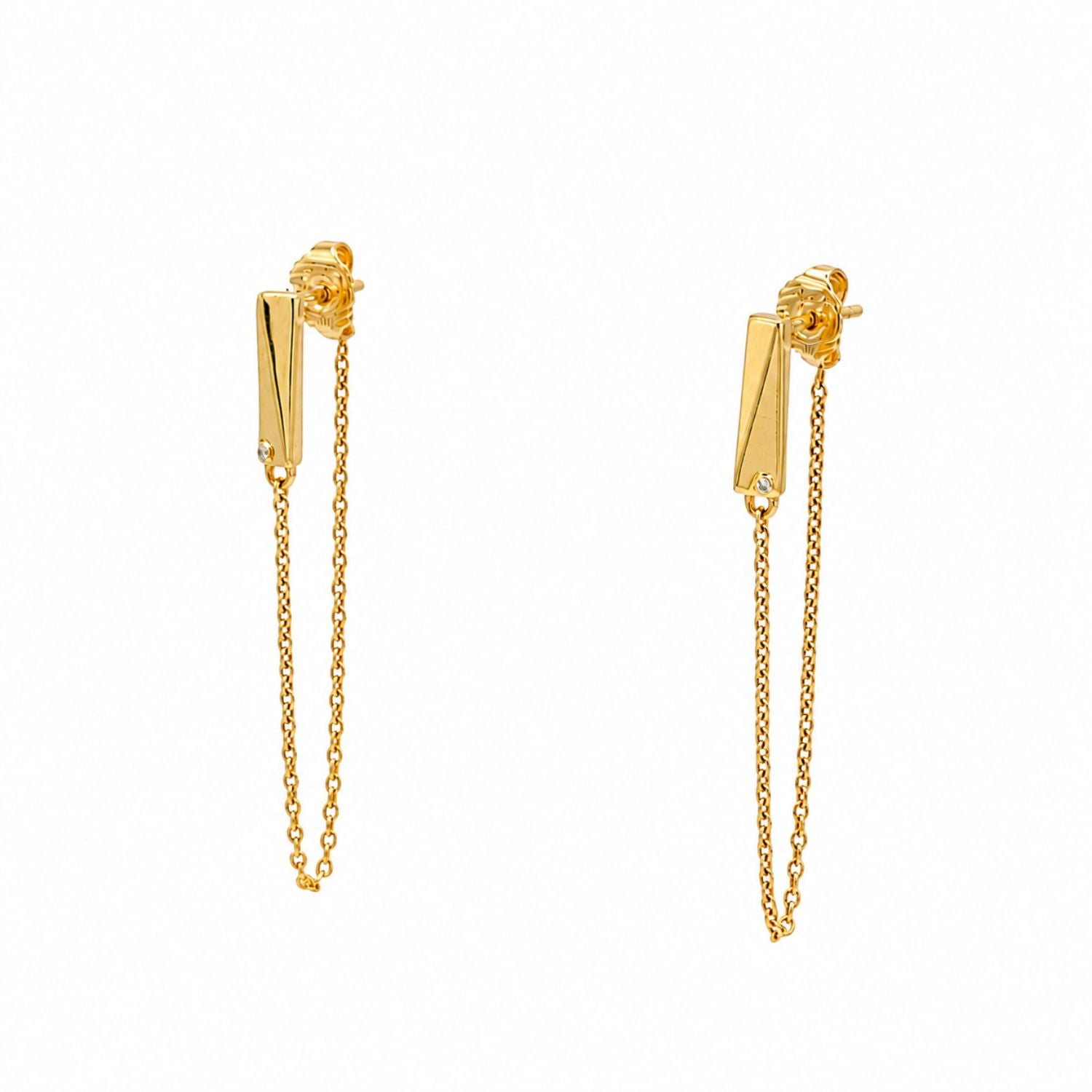 A pair of gold vermeil earrings with a chain attached to a stud and butterfly back, featuring round lab grown diamonds.