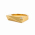 A gold geometric ring with a small square diamond accent, shown on a clean white background.