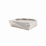 A silver geometric ring with a small square clear gemstone, shown on a plain white background.