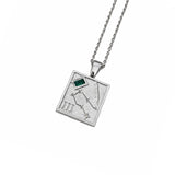 A silver-toned square pendant necklace featuring an engraved constellation design, Roman numeral III, and a small green rectangular inset, suspended from a matching silver chain against a plain white background.
