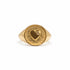 A gold signet ring featuring a textured oval face with a central heart motif and a small round clear lab-grown diamond, shown on a plain white background.