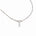 A silver paperclip chain necklace featuring a polished heart-shaped pendant with a small teardrop pearl charm below it, displayed on a clean white background.