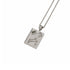 A silver-toned rectangular pendant necklace featuring an engraved zodiac symbol, a flower motif, and a small green gemstone, shown on a clean white background.