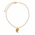 A pearl necklace with a gold chain and a gold spiral shell pendant, displayed on a clean white background.