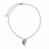 A pearl necklace with a silver spiral shell pendant, displayed on a clean white background.