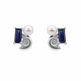 Sterling silver stud earrings with a blue sapphire, shell, lab-grown diamond and pearl on a white background.