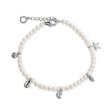 A pearl charm bracelet with a silver-tone clasp and five dangling charms shaped like a starfish, a seashell, a leaf, a spiral shell, and a hexagon, shown on a plain white background.