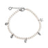 A pearl charm bracelet with a silver-tone clasp and five dangling charms shaped like a starfish, a seashell, a leaf, a spiral shell, and a hexagon, shown on a plain white background.