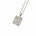 A silver pendant necklace featuring a rectangular shape, engraved details, a textured floral motif, and small clear gemstones, suspended from a delicate gold chain on a white background.