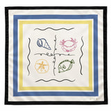 A square scarf with a white base, featuring a black border, a blue and yellow inner border, and four nautical illustrations (a blue seashell, a pink crab, a yellow sand dollar, and a green fish) arranged in a grid. The brand name 'CIER' is printed in the bottom right corner.