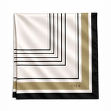 A square silk scarf with a geometric Art Deco design, featuring black lines on an off-white background, a gold border, and a black edge. The brand name 'CIER' is printed in gold on the bottom right corner.