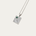 Silver necklace with a pendant featuring a green gemstone on a white background