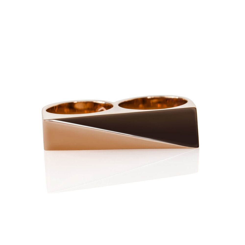 A double-fingered ring with a 14K plated rose gold band on top of a brass base, displayed against a white background.
