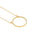 A 14K gold plated circular necklace on a white background shot in studio.