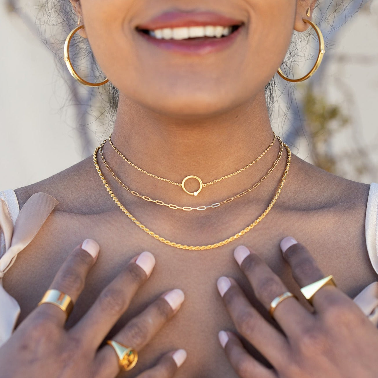 This sleek Paperclip Chain Necklace is crafted from sterling silver with 14K Gold Vermeil for an elegant, polished look that is sure to turn heads. The length of the necklace can be adjusted to fit any neckline, and its strong construction ensures lasting quality. Pair with the Flex necklace or the Cyclical Choker to create the perfect layering look. 